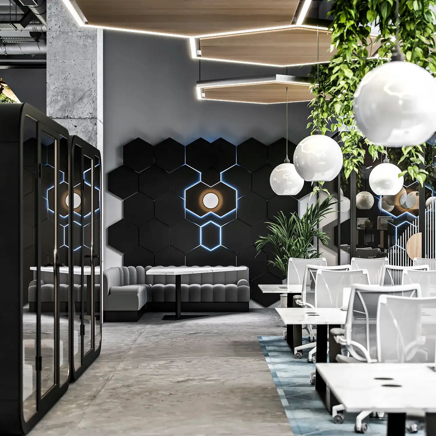 Modern office lounge with hexagonal black wall panels, gray seating, white pendant lights, potted plants, and work tables with chairs.