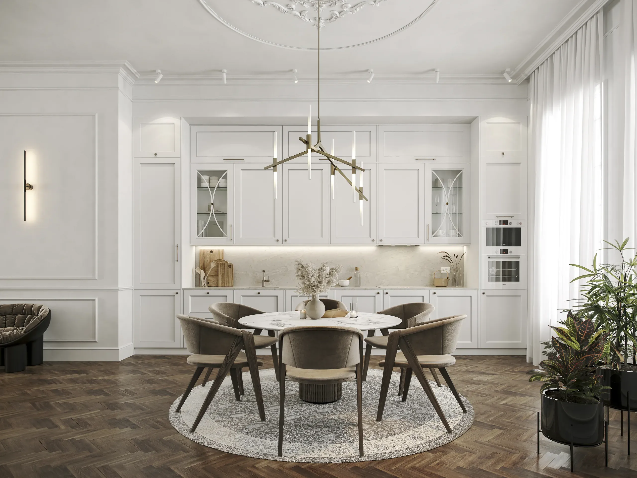 Modern open-plan kitchen and dining room with white cabinetry, round marble table, upholstered chairs, herringbone flooring, and brass pendant light fixture.
