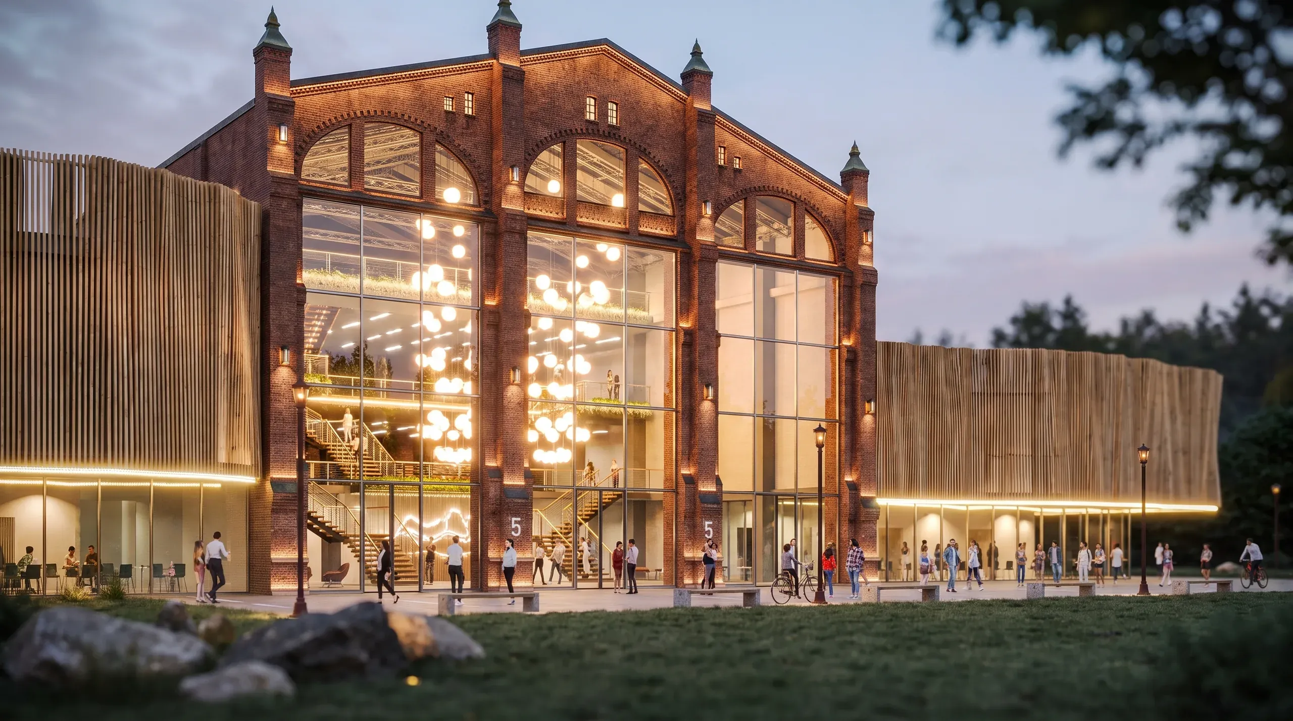 Modern brick building with large arched windows illuminated at dusk, featuring contemporary metal-clad wings and people gathering in the plaza.