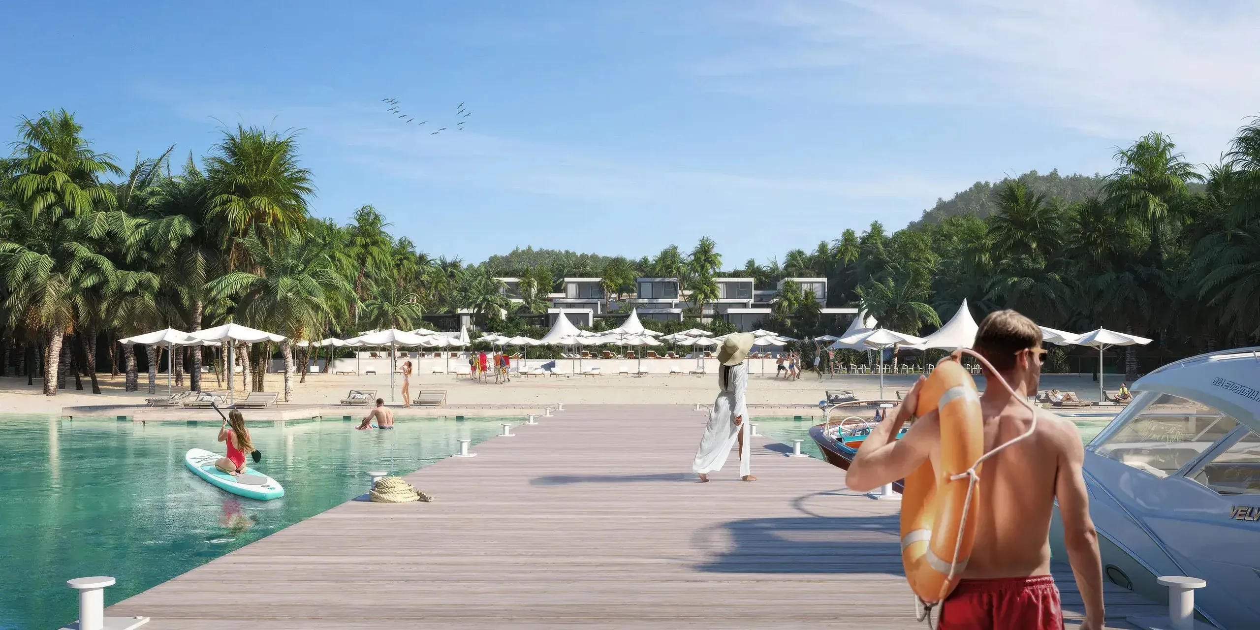 A modern beachfront resort with wooden dock, turquoise water, white umbrellas, palm trees, and contemporary buildings nestled among tropical vegetation under clear blue sky.