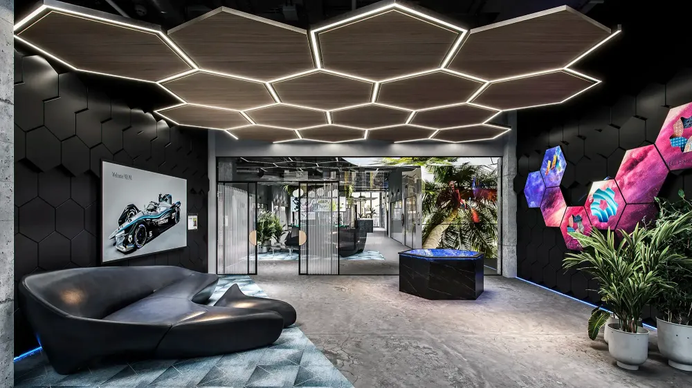 NEOM futuristic lobby with hexagonal LED ceiling and Formula E car display