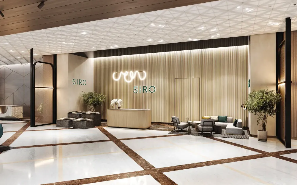 SIRO elevator lobby with geometric wood panels, marble console, and olive trees