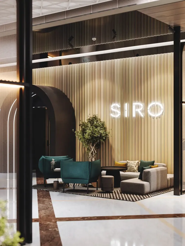 SIRO lobby detail with travertine desk, geometric ceiling, and brass accents