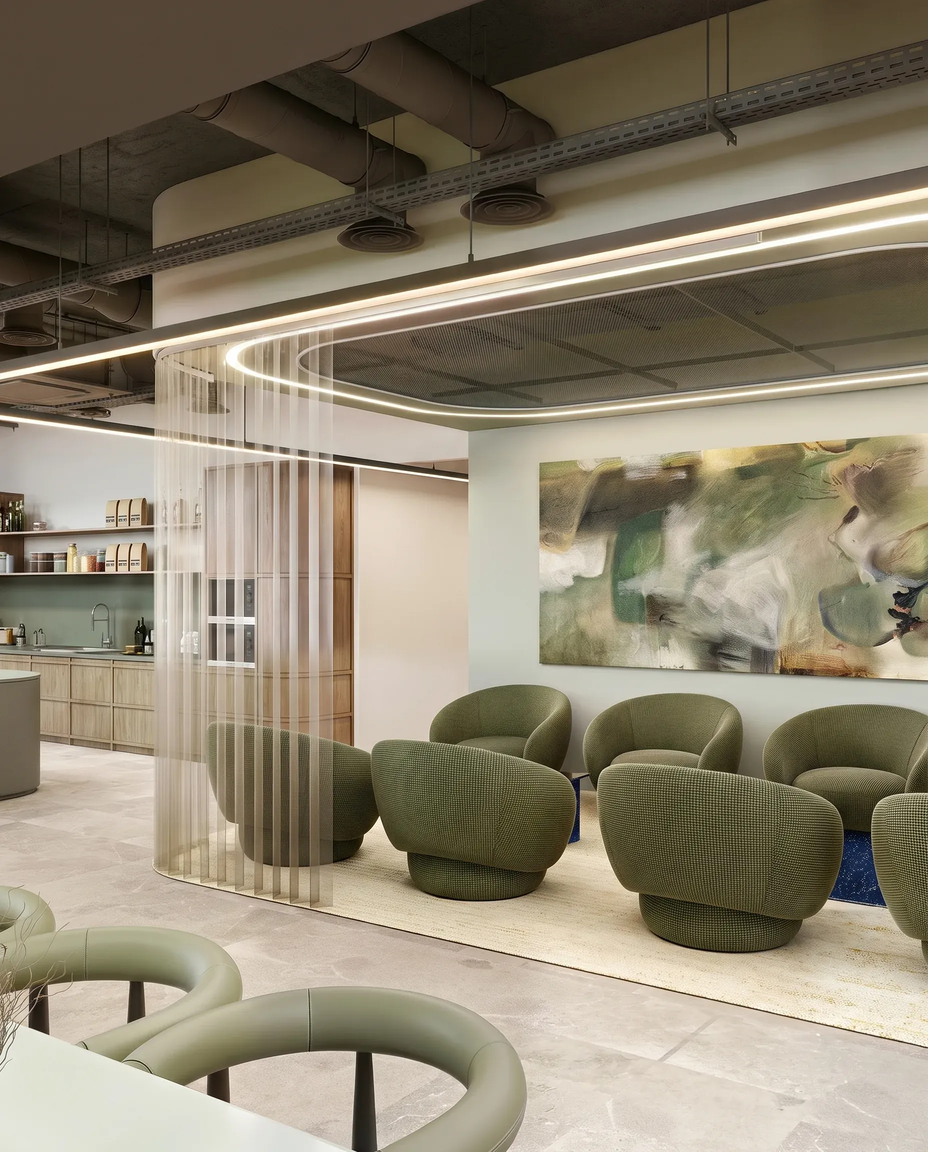 Modern office lounge with green upholstered chairs, linear ceiling lights, white striped room divider, abstract wall art, and kitchen area in background.