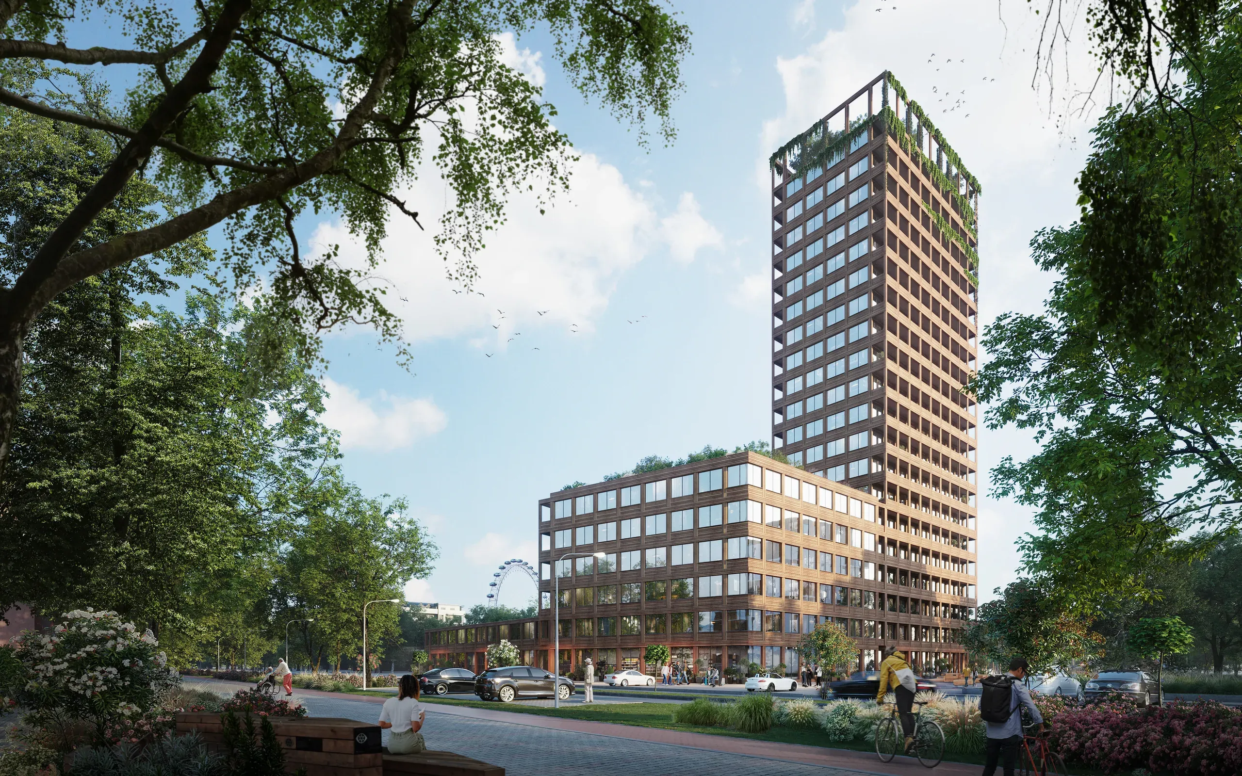 Modern mixed-use building with tall tower and lower podium featuring green roofing, surrounded by mature trees and street-level plaza with pedestrians and cyclists.