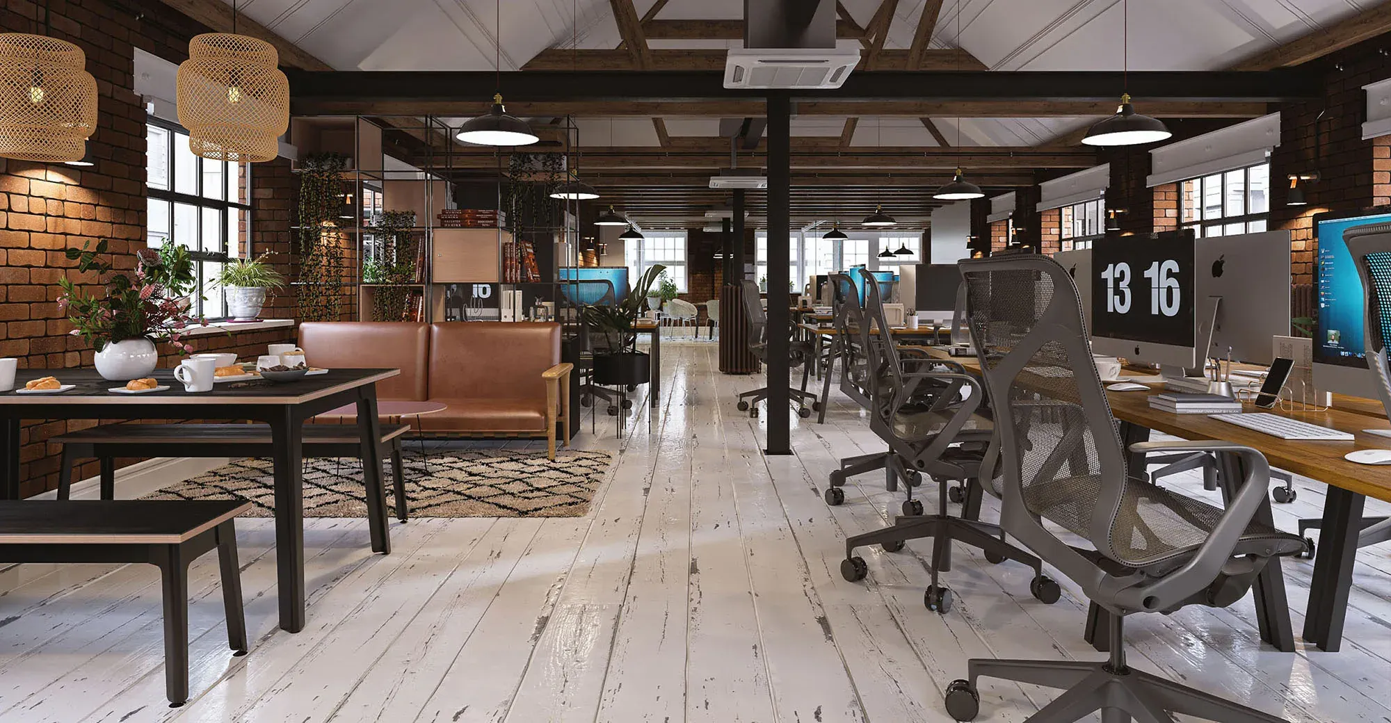 Modern open-plan office with exposed brick, wooden beams, ergonomic chairs, dining area with copper sofa, potted plants, and natural lighting from large windows.