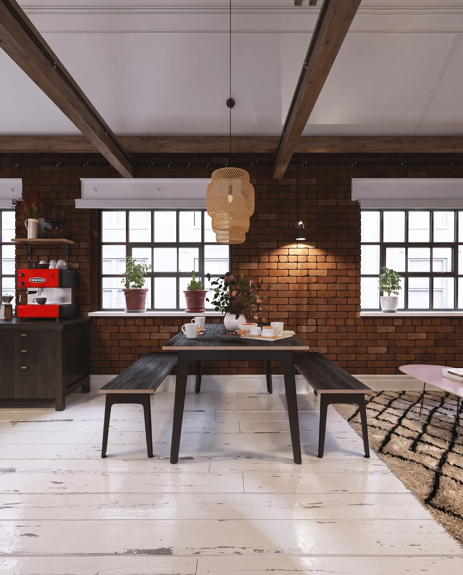 Industrial loft dining space with exposed brick walls, wooden beams, woven pendant light, dark table with benches, large windows, and potted plants.