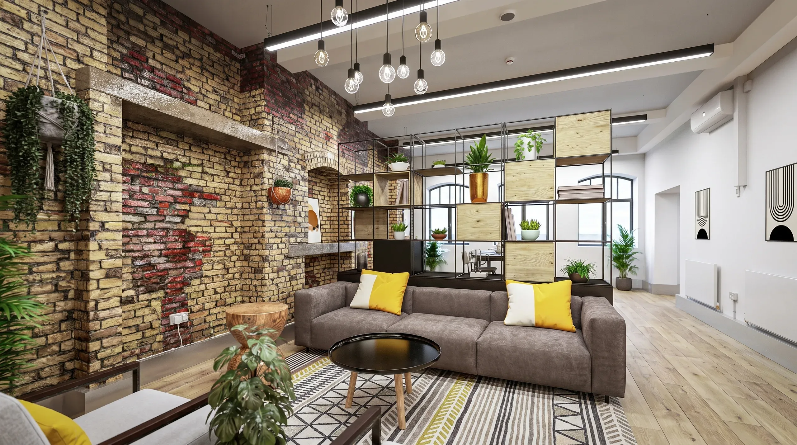 Modern loft living room with exposed brick wall, gray sofa with yellow pillows, industrial pendant lights, and metal shelving unit displaying plants.