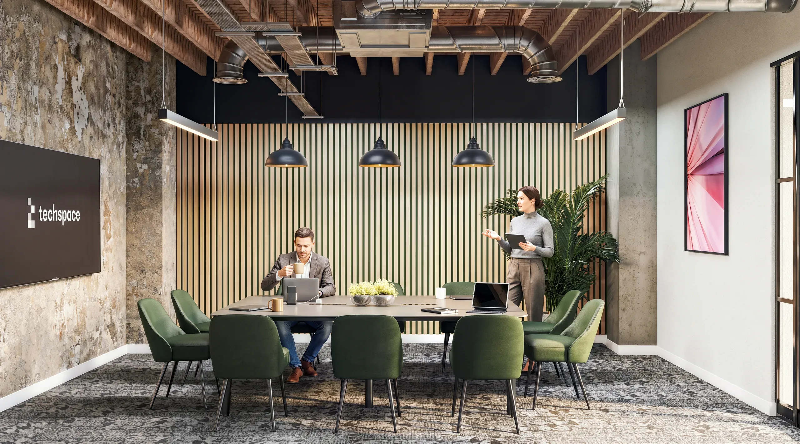 Modern techspace office meeting room with wood-slat accent wall, green chairs, industrial ceiling, and two professionals working at a table.