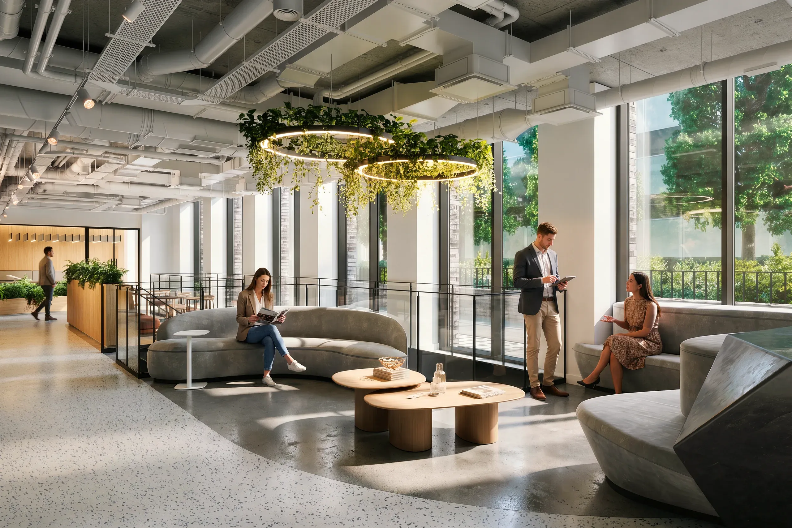 Modern office lounge with curved gray seating, wooden tables, hanging plants, floor-to-ceiling windows, and professionals working in an open space.