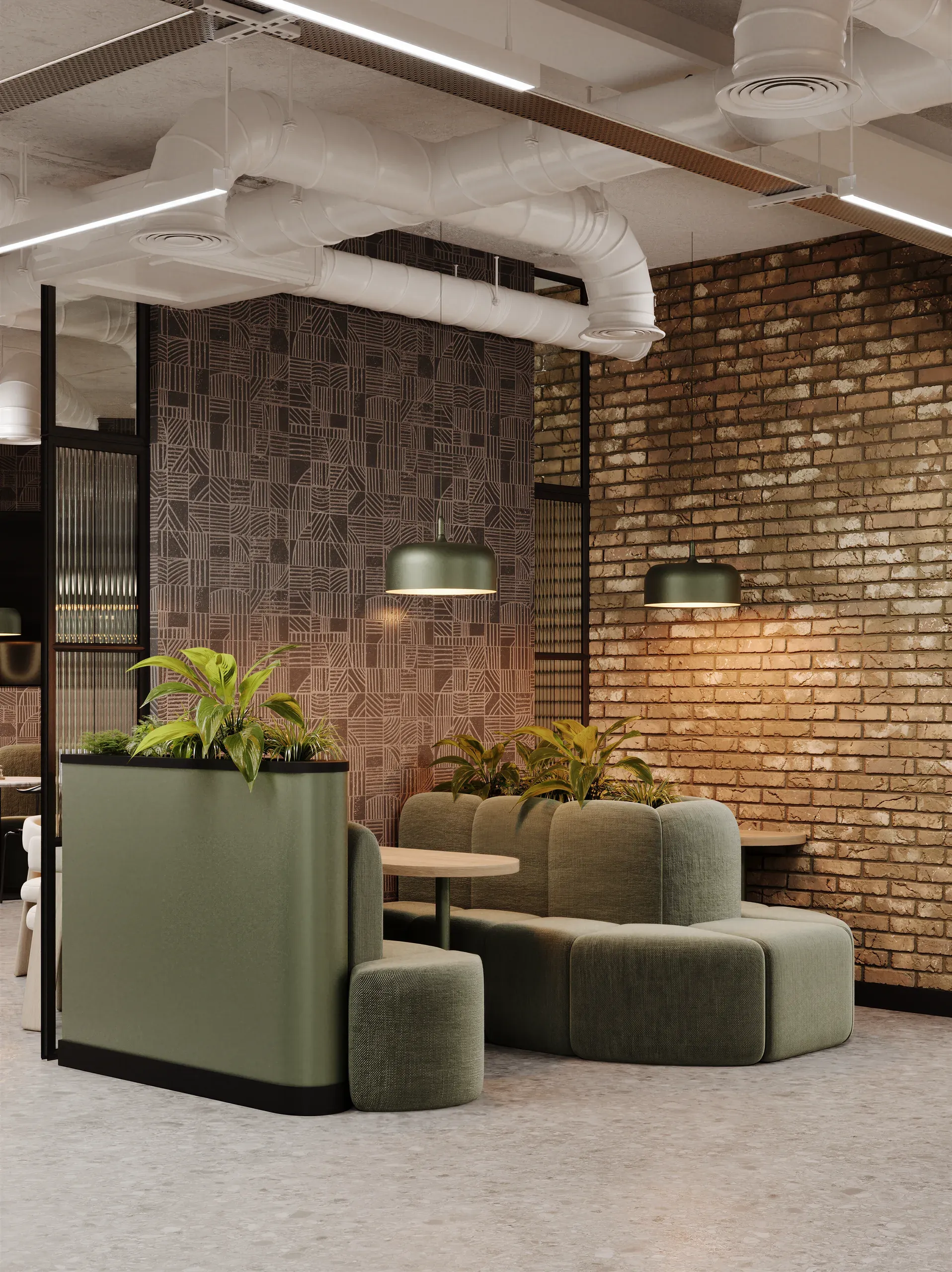 Modern office lounge with green modular seating, potted plants, exposed brick wall, patterned room divider, pendant lights, and industrial ceiling details.