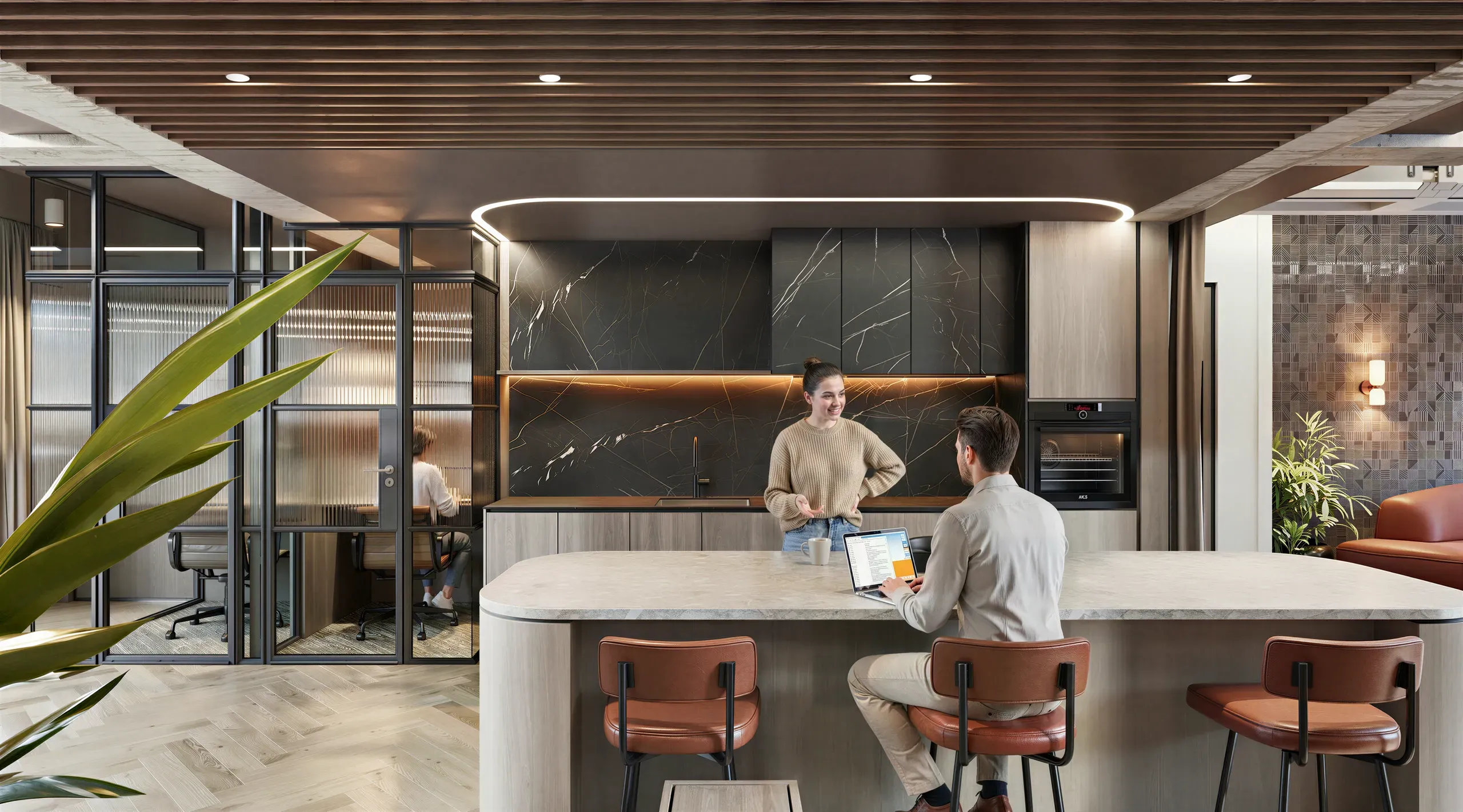 Modern office kitchen with two people at marble counter, leather bar stools, black marble backsplash, wooden ceiling, and glass-walled meeting room visible in background.