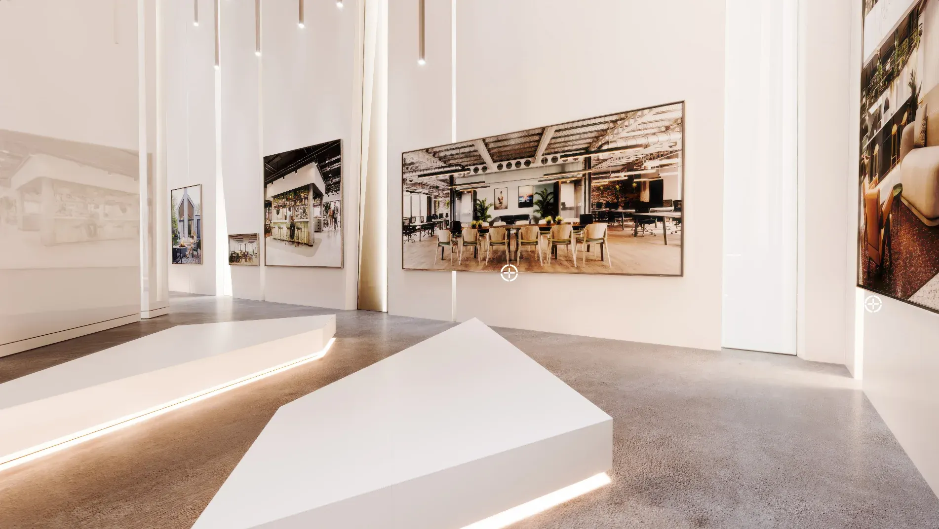 Modern gallery space with white walls, architectural photographs displayed, minimalist white sculptural element in foreground, polished concrete flooring, and recessed lighting.